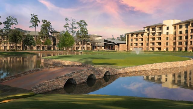Picturesque Woodlands Ballroom for conferences with serene water features and outdoor spaces.