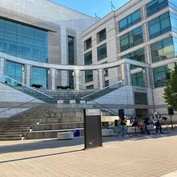 Genentech Hall outdoor event space with modern architecture and live music for gatherings.