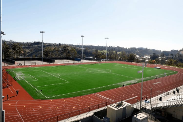 Jesse Owens Stadium outdoor sports field for events and athletics, with ample seating.