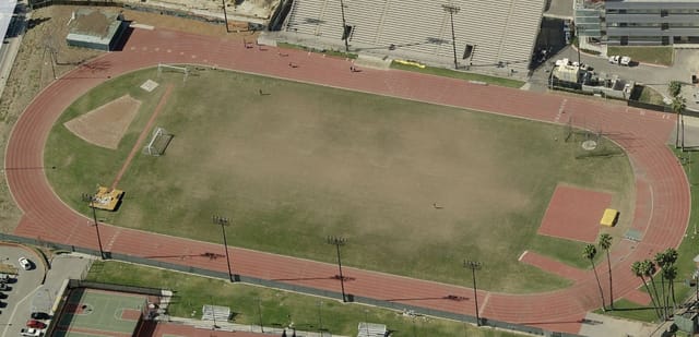 Stadium at Jesse Owens: versatile sports field with running track for events and activities