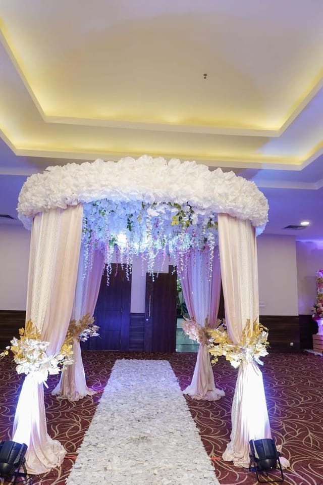 Elegant wedding altar with floral canopy at Crystal Ballroom, perfect for romantic ceremonies.
