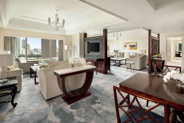 Elegant hotel suite with city views for corporate events at Shangri-La Jakarta.