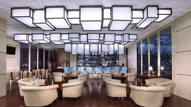 Modern lounge in The Grove Suites for networking events and cocktail receptions.