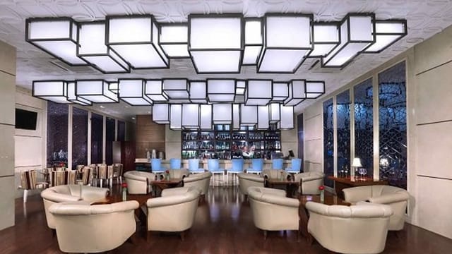 Modern lounge in The Grove Suites for networking events and cocktail receptions.