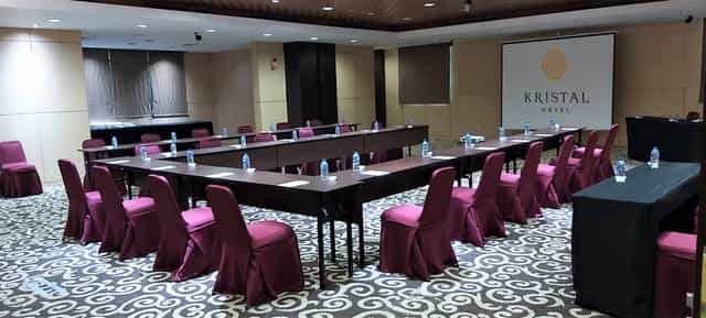 Sapphire Room at Kristal Hotel, U-shaped seating for corporate meetings and workshops.