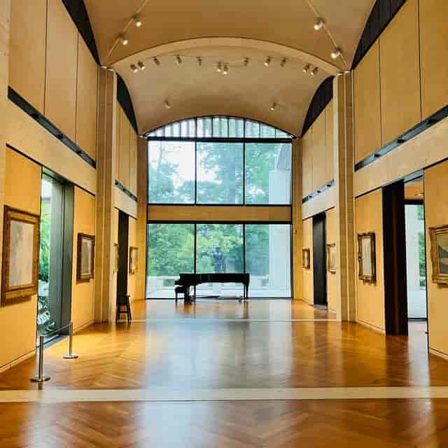 Great Hall at Kreeger Museum with grand piano, ideal for elegant events and receptions.