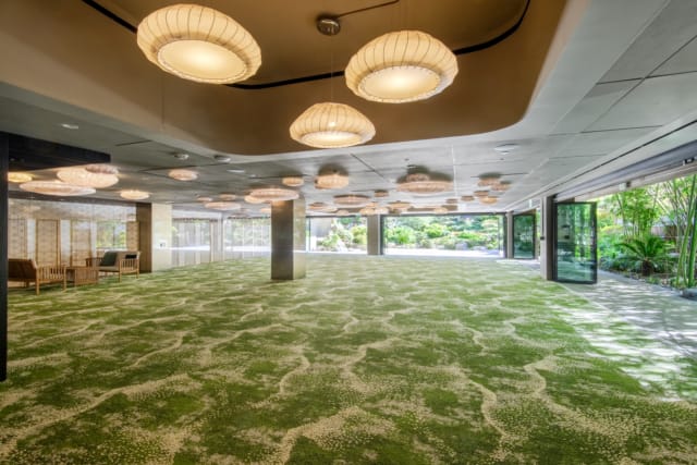 Conference room with large windows and modern decor at Japanese American Cultural Center.