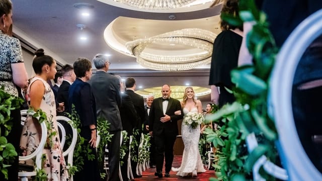 Wedding ceremony setup in Cecchi Junior Ballroom with elegant decor and soft lighting.