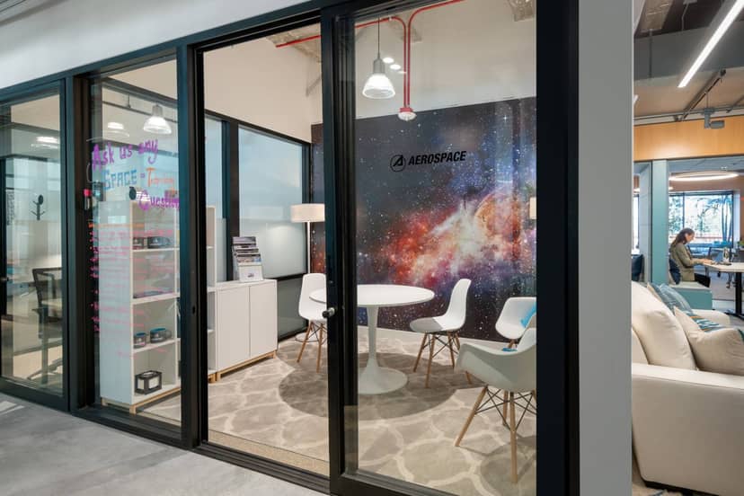 Modern meeting space with glass facade in Virtual Office, ideal for brainstorming and client meetings.