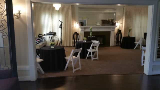 Elegant dining room with black linens, ideal for intimate networking events.