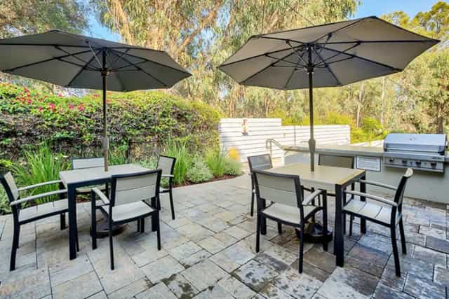 Patios in The Granada with shaded tables, ideal for outdoor meetings and networking.
