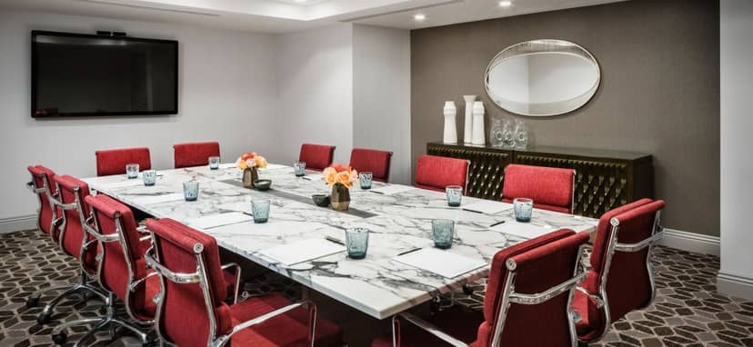 Modern conference room at The Darcy with marble table, ideal for corporate meetings.