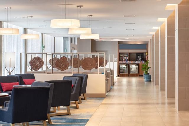 Modern meeting room at Holiday Inn LAX with inviting seating for corporate events.