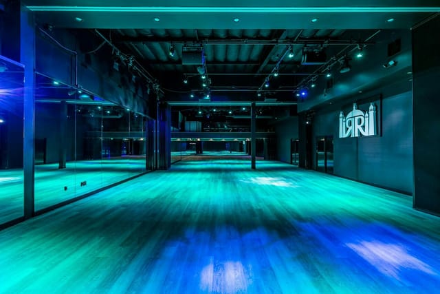 Modern RRB Studios event space with vibrant lighting for dynamic workshops and fitness events.