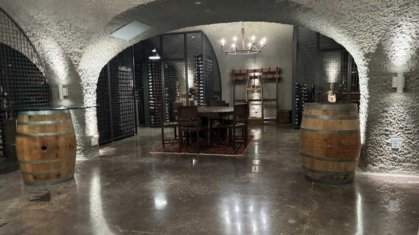 Elegant wine cellar with arched ceilings, ideal for tastings and corporate retreats.