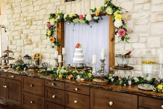 Elegant dessert table with tiered cake for wedding at Acadian Event Services.