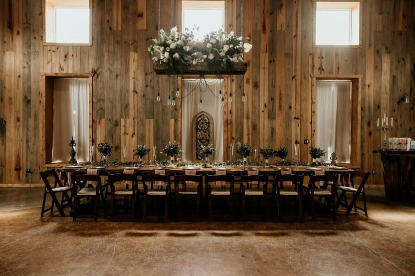 Elegant ballroom dining setup with floral centerpieces for events and gatherings.