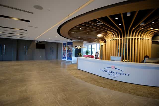 Modern meeting rooms with warm accents at Tanglin Trust School for professional events.