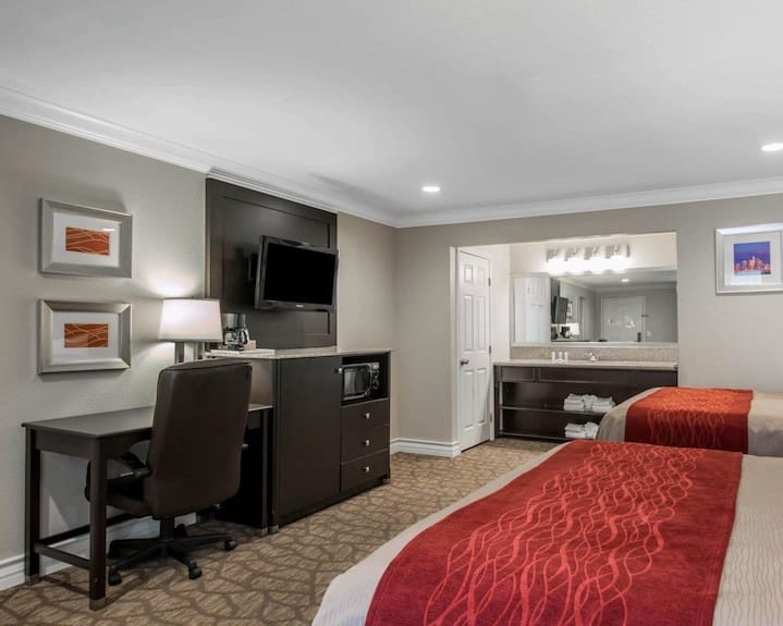 Quality Inn Downey guest room with two beds, ideal for business events and conferences.