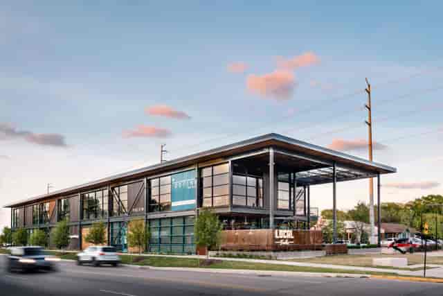 Modern event venue with large glass windows, ideal for gatherings at Heights Mercantile.
