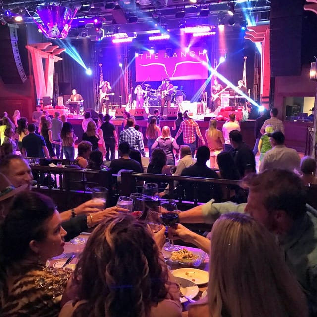 Vibrant dance studio with attendees enjoying a live band performance at Swing N Country.