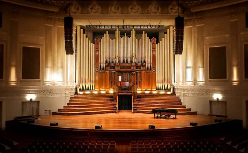 Redondo Beach Performing Arts Center auditorium with grand organ and tiered seating for events.
