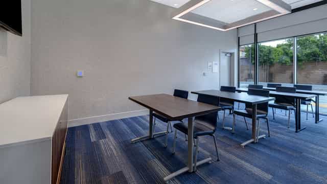 Modern meeting room with natural light for workshops at Holiday Inn Express Glendale.
