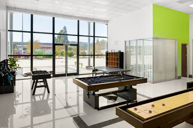 Modern shared workspace in Cubework with recreational amenities for networking events.