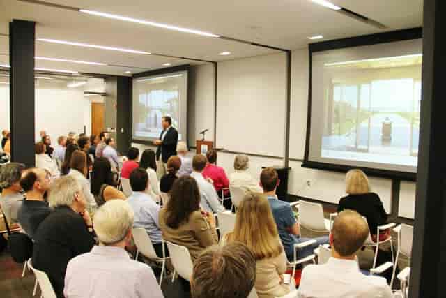 Engaged audience at Clark Construction Classroom during a presentation event. 