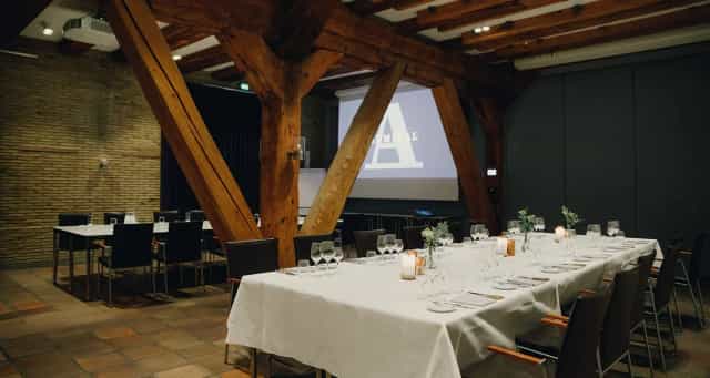 Elegant banquet setup in Admiral Hotel for corporate events and gatherings.