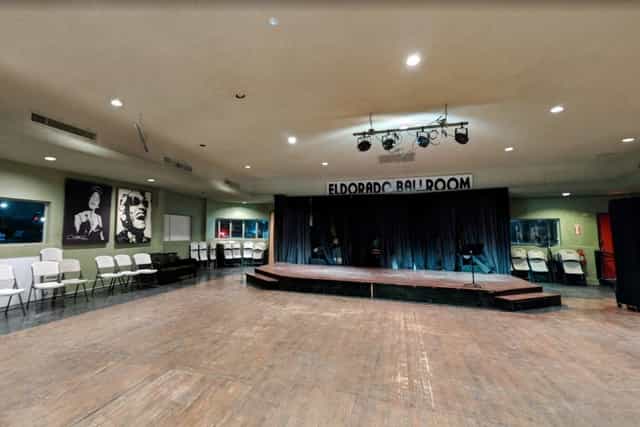 Versatile Bellagio Banquet Hall with stage and adjustable lighting for conferences and banquets.