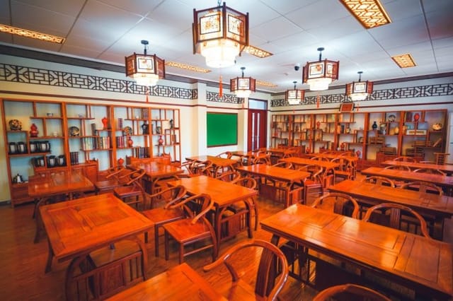 Classroom at Shanghai University with wooden tables, ideal for workshops and group sessions.