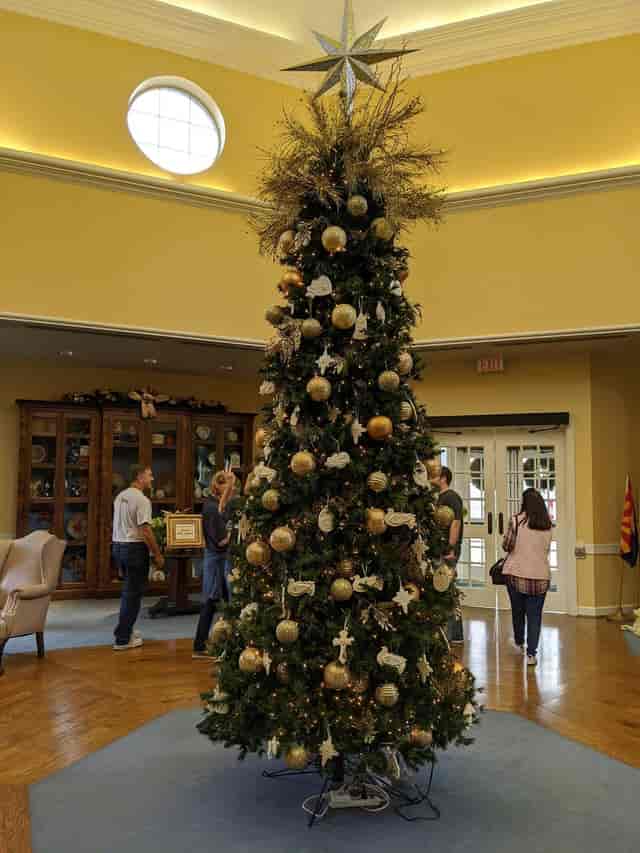 "Christmas tree centerpiece in Brookwood Community ballroom for festive holiday events"