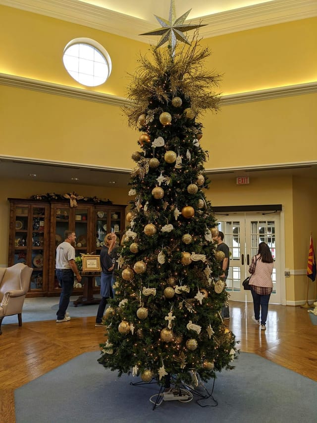 "Christmas tree centerpiece in Brookwood Community ballroom for festive holiday events"