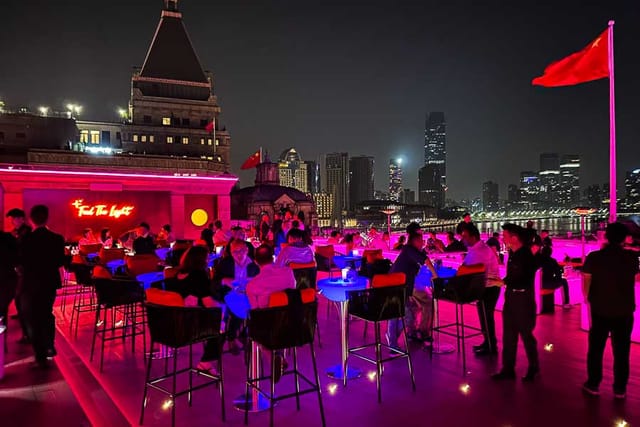 Bar Rouge rooftop venue with colorful lighting, perfect for upscale networking events.
