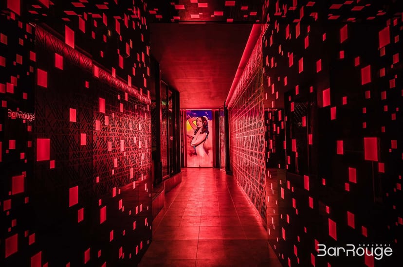 "Bar Rouge Bund 18 corridor with vibrant red lighting, ideal for networking events and parties."