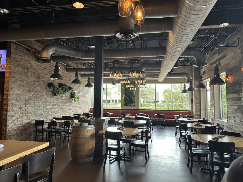 Stylish Karbach Brewing Co. beer garden with rustic decor, perfect for events and gatherings.