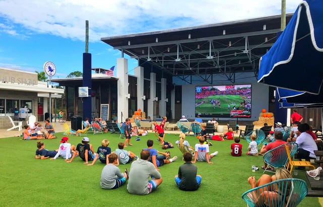 Outdoor event lawn at Allen Center with seating, perfect for family gatherings and presentations.