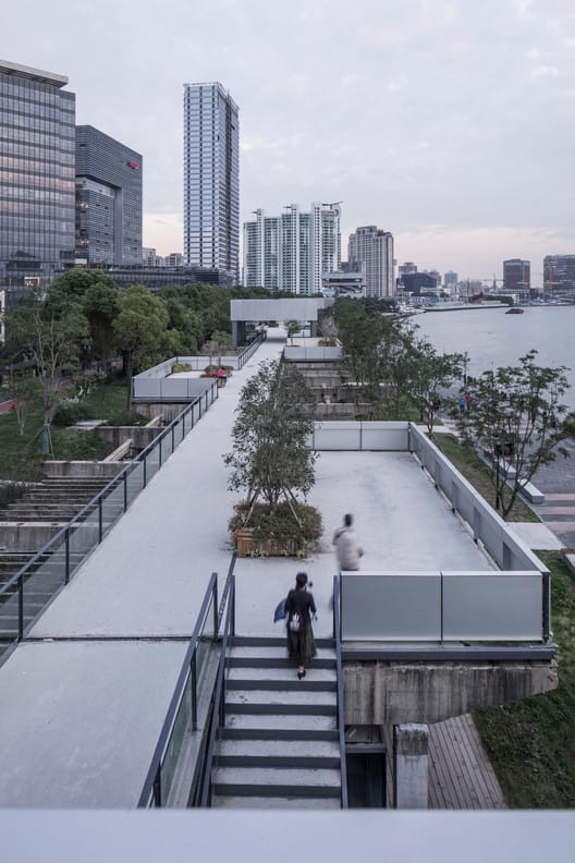 Serene waterfront pathway at Modern Art Museum Shanghai, perfect for outdoor events.