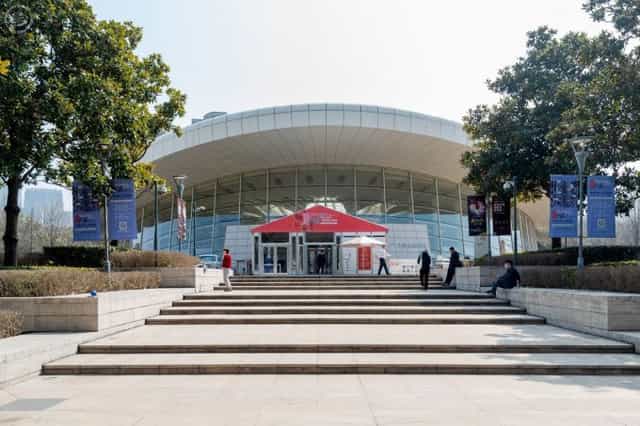 Modern Shanghai Culture Square theatre with sleek glass façade, perfect for events and exhibitions.