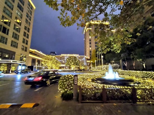 Illuminated venue entrance at Huangpu River for upscale outdoor events.