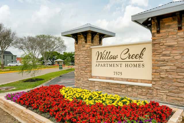 Welcoming entrance of Willow Creek Apartment Homes, perfect for community events and gatherings.