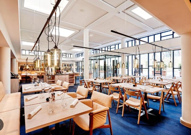 Modern restaurant interior at NOI, Nobis Hotel, Copenhagen - ideal for events and gatherings.