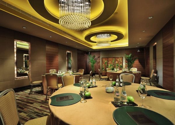 Elegant event space with round tables for corporate meetings and social gatherings in Sofitel Shanghai.