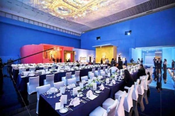 Sophisticated small event space with blue walls for formal dinners and celebrations.