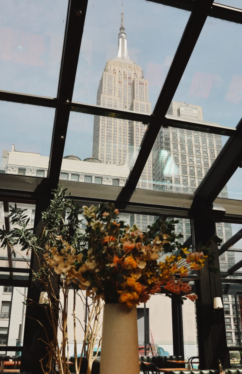Modern event space with glass ceiling, ideal for corporate meetings and social gatherings.