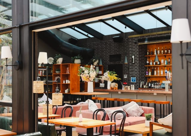 Modern Glass Ceiling venue with natural light, ideal for events and meetings.