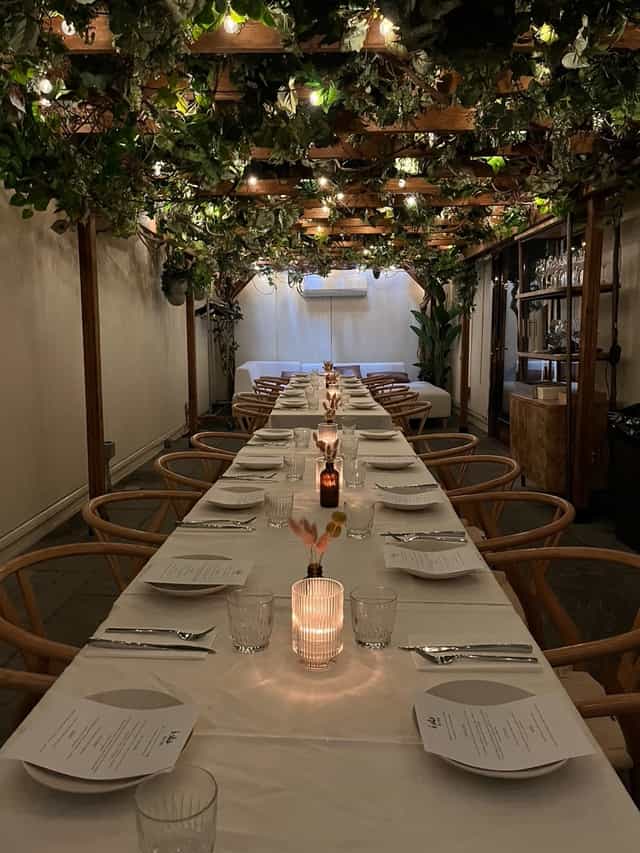 Private dining room at Isla & Co. Midtown, featuring an elegant long table for gatherings.
