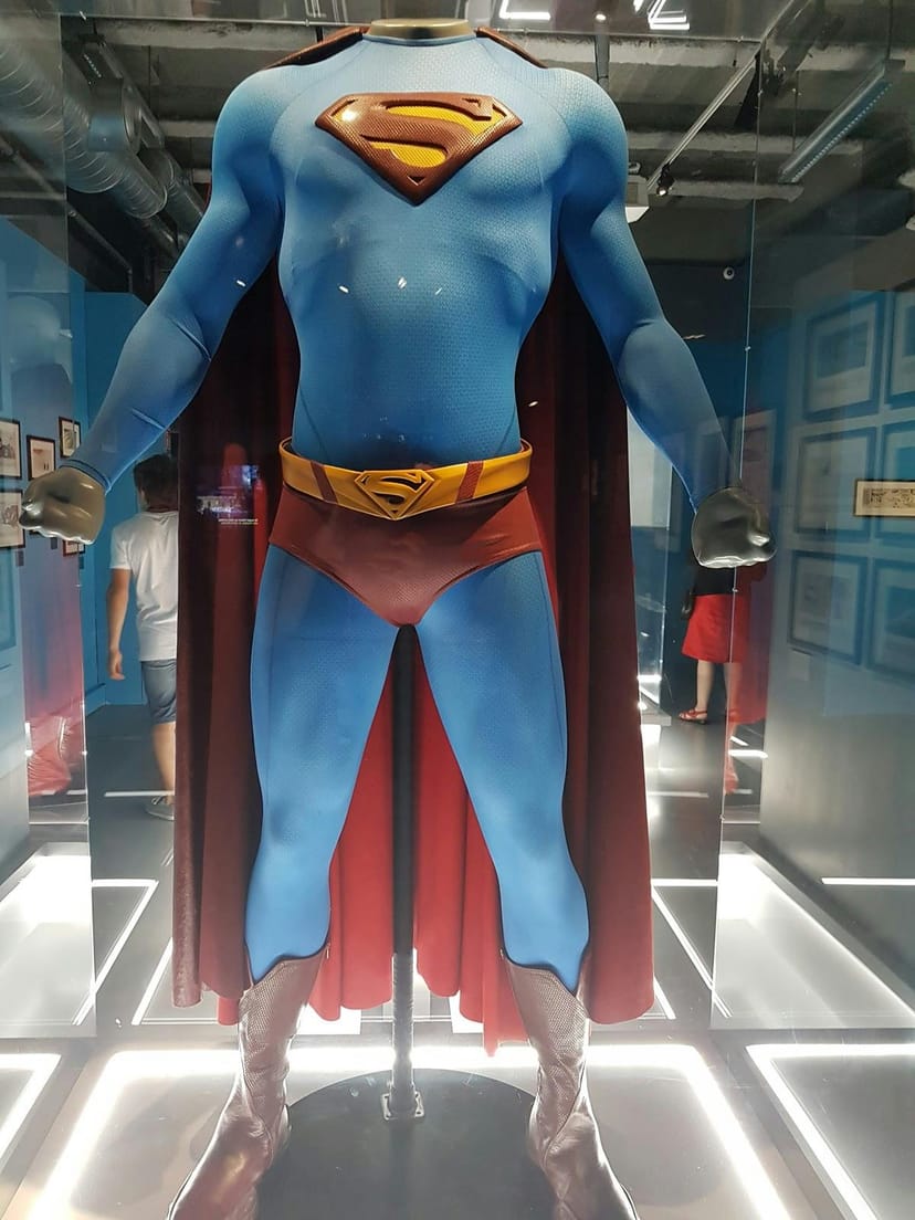 Vibrant superhero costume display at Cité de la Mode et du Design pop culture event.