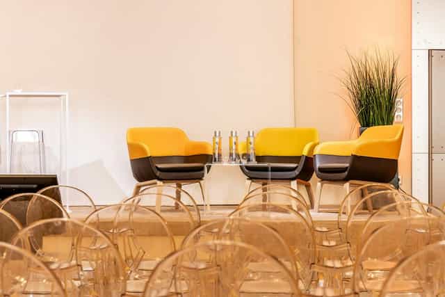 Modern event space at Salon De La Vaulx with stylish seating for panels and discussions.